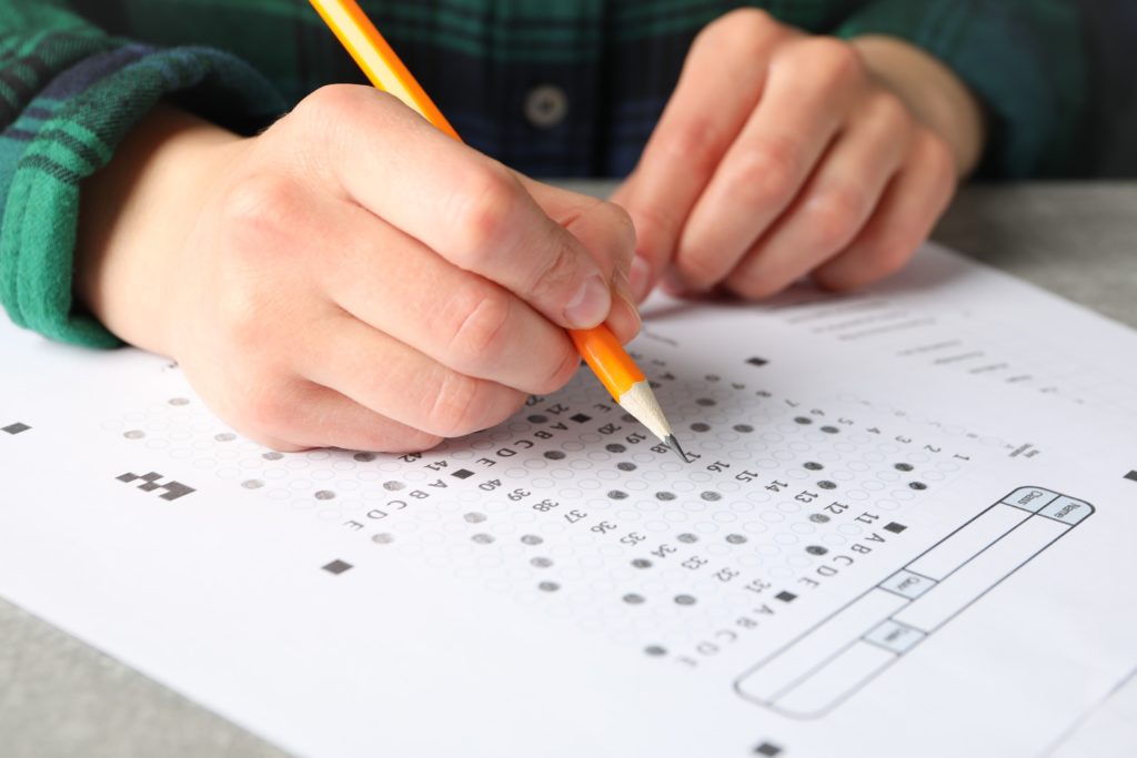 image of woman filling out test sheet