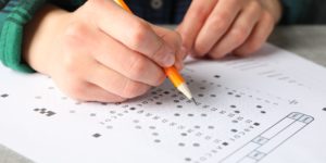 image of woman filling out test sheet