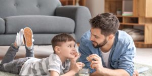 Image of Little boy and father with savings